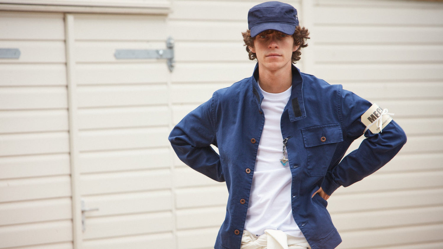 Male model at Goodwood Motor Circuit wearing leather jacket and Revival pocket t-shirt