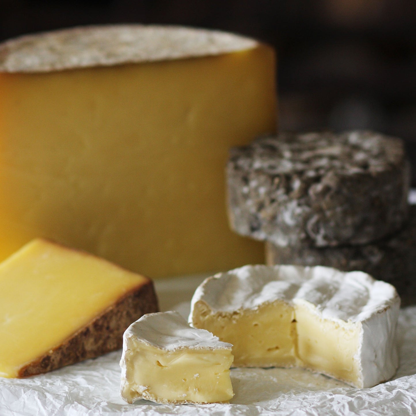 Close up of the Goodwood Cheese Board Trio, containing Goodwood's handmade mature Charlton Cheese, Levin Down and Molecomb Blue.