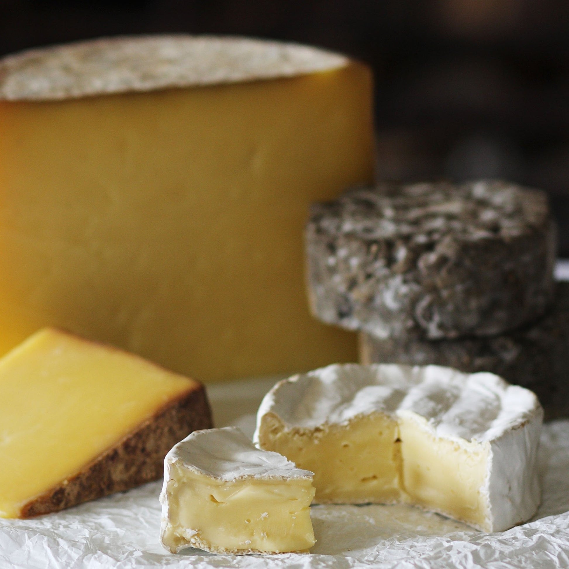 Close up of the Goodwood Cheese Board Trio, containing Goodwood's handmade mature Charlton Cheese, Levin Down and Molecomb Blue.