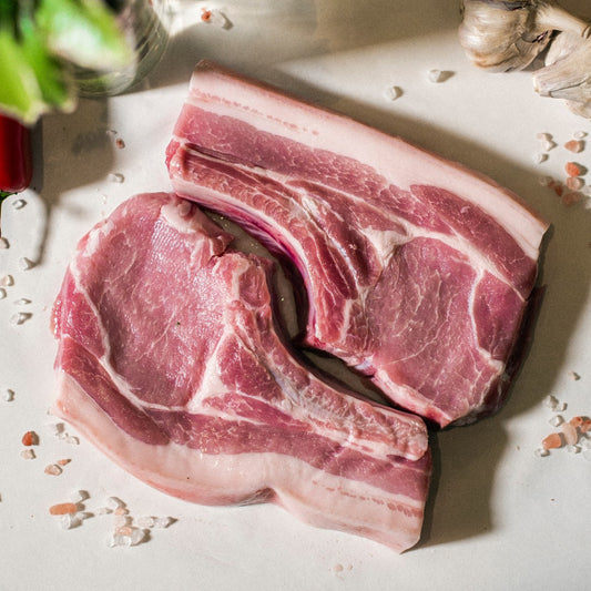 A top down view of Goodwood Farm Shop's organic grass-fed West Sussex pork loin chops.