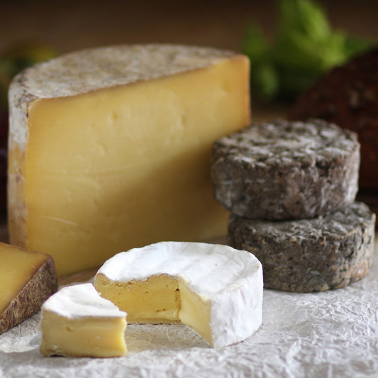 Close up of the Goodwood Cheese Board Trio, containing Goodwood's handmade mature Charlton Cheese, Levin Down and Molecomb Blue.